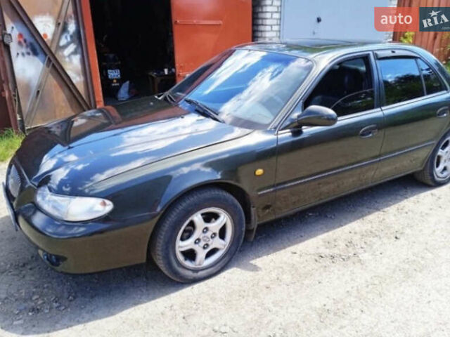 Зеленый Хендай Соната, объемом двигателя 2 л и пробегом 225 тыс. км за 2600 $, фото 1 на Automoto.ua