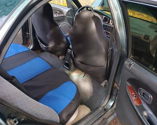 Зеленый Хендай Соната, объемом двигателя 2 л и пробегом 312 тыс. км за 1800 $, фото 7 на Automoto.ua