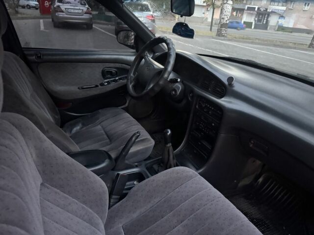 Зеленый Хендай Соната, объемом двигателя 2 л и пробегом 478 тыс. км за 1800 $, фото 5 на Automoto.ua