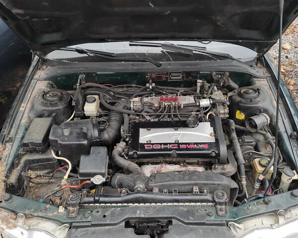 Зеленый Хендай Соната, объемом двигателя 2 л и пробегом 235 тыс. км за 1300 $, фото 5 на Automoto.ua