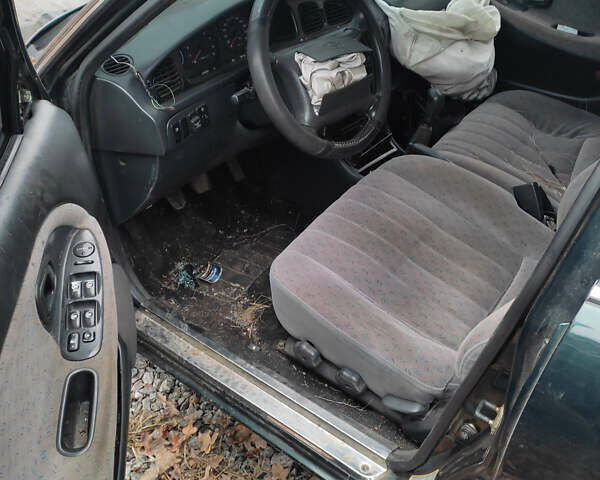 Зеленый Хендай Соната, объемом двигателя 2 л и пробегом 235 тыс. км за 1300 $, фото 6 на Automoto.ua