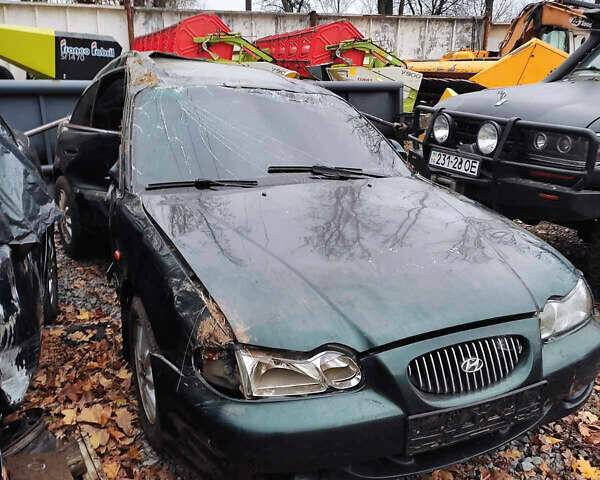 Зеленый Хендай Соната, объемом двигателя 2 л и пробегом 235 тыс. км за 1300 $, фото 3 на Automoto.ua