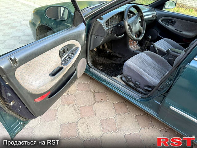 Зеленый Хендай Соната, объемом двигателя 2 л и пробегом 555 тыс. км за 1275 $, фото 9 на Automoto.ua