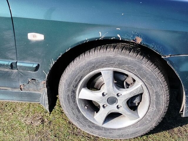 Зеленый Хендай Соната, объемом двигателя 2 л и пробегом 257 тыс. км за 3000 $, фото 3 на Automoto.ua