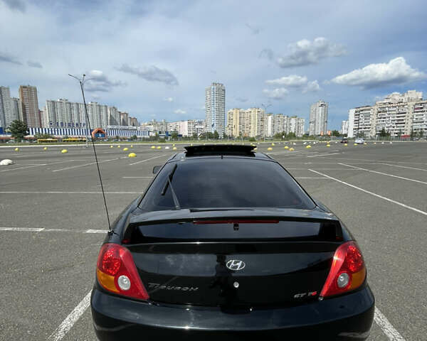 Чорний Хендай Тібурон, об'ємом двигуна 2.7 л та пробігом 67 тис. км за 6000 $, фото 29 на Automoto.ua