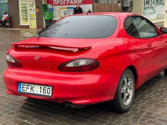 Красный Хендай Тибурон, объемом двигателя 2 л и пробегом 200 тыс. км за 2999 $, фото 6 на Automoto.ua