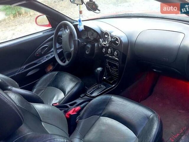 Красный Хендай Тибурон, объемом двигателя 2 л и пробегом 186 тыс. км за 4000 $, фото 3 на Automoto.ua