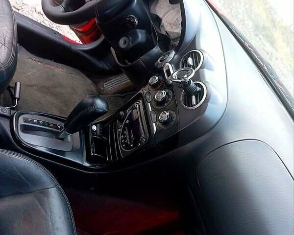 Красный Хендай Тибурон, объемом двигателя 2 л и пробегом 186 тыс. км за 4000 $, фото 6 на Automoto.ua