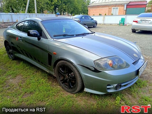 Серый Хендай Тибурон, объемом двигателя 2 л и пробегом 200 тыс. км за 3500 $, фото 1 на Automoto.ua