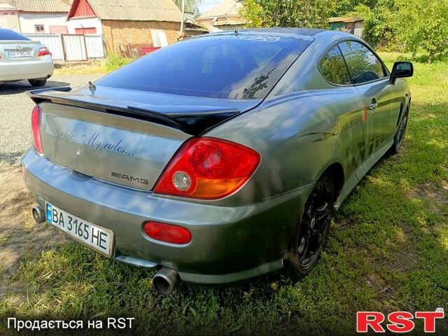 Серый Хендай Тибурон, объемом двигателя 2 л и пробегом 200 тыс. км за 3500 $, фото 5 на Automoto.ua