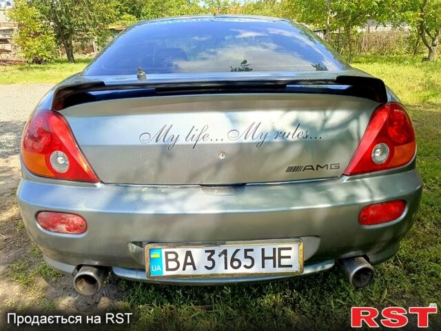 Серый Хендай Тибурон, объемом двигателя 2 л и пробегом 200 тыс. км за 3500 $, фото 4 на Automoto.ua