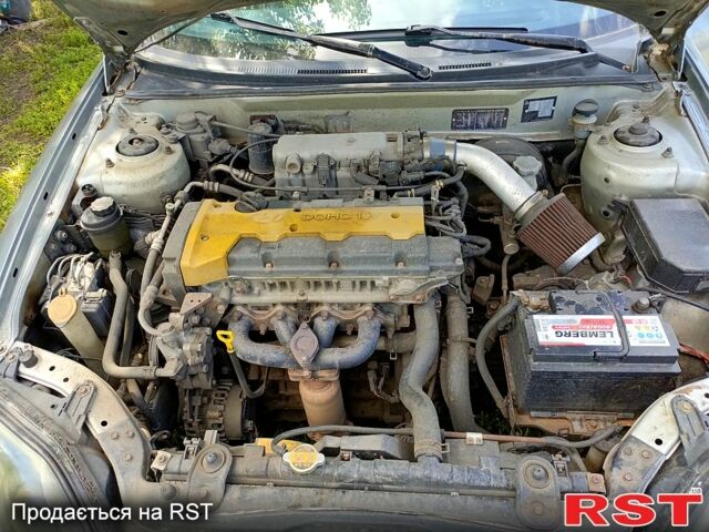 Серый Хендай Тибурон, объемом двигателя 2 л и пробегом 200 тыс. км за 3500 $, фото 9 на Automoto.ua