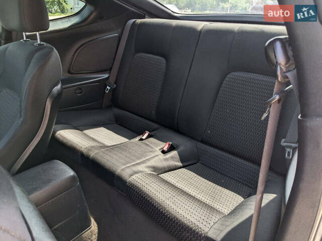 Серый Хендай Тибурон, объемом двигателя 2 л и пробегом 101 тыс. км за 7500 $, фото 2 на Automoto.ua