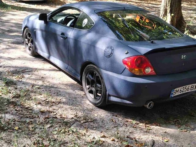 Синий Хендай Тибурон, объемом двигателя 2 л и пробегом 178 тыс. км за 2800 $, фото 3 на Automoto.ua