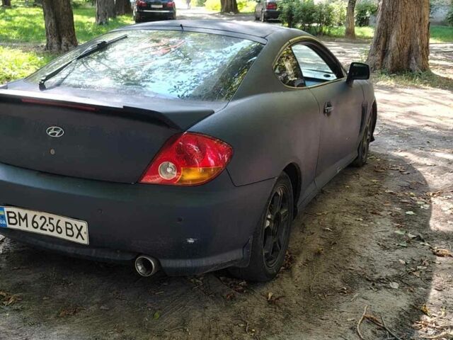 Синий Хендай Тибурон, объемом двигателя 2 л и пробегом 178 тыс. км за 2800 $, фото 2 на Automoto.ua