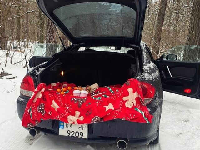 Синий Хендай Тибурон, объемом двигателя 2 л и пробегом 165 тыс. км за 6395 $, фото 4 на Automoto.ua