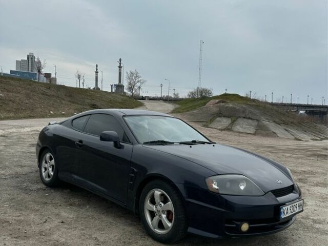 Синий Хендай Тибурон, объемом двигателя 2 л и пробегом 165 тыс. км за 6395 $, фото 5 на Automoto.ua