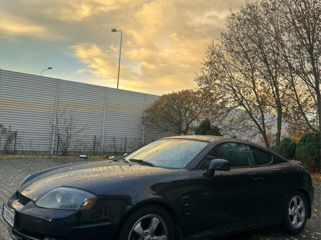 Синий Хендай Тибурон, объемом двигателя 2 л и пробегом 165 тыс. км за 6395 $, фото 1 на Automoto.ua