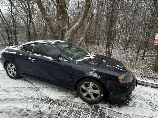 Синий Хендай Тибурон, объемом двигателя 2 л и пробегом 165 тыс. км за 6395 $, фото 3 на Automoto.ua