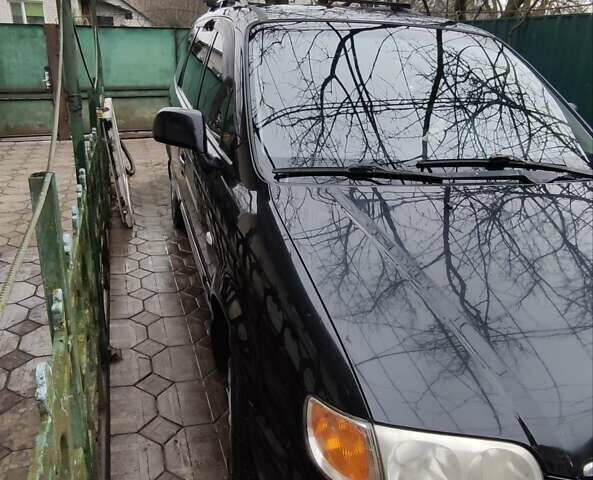 Черный Хендай Траджет, объемом двигателя 2 л и пробегом 297 тыс. км за 4500 $, фото 2 на Automoto.ua