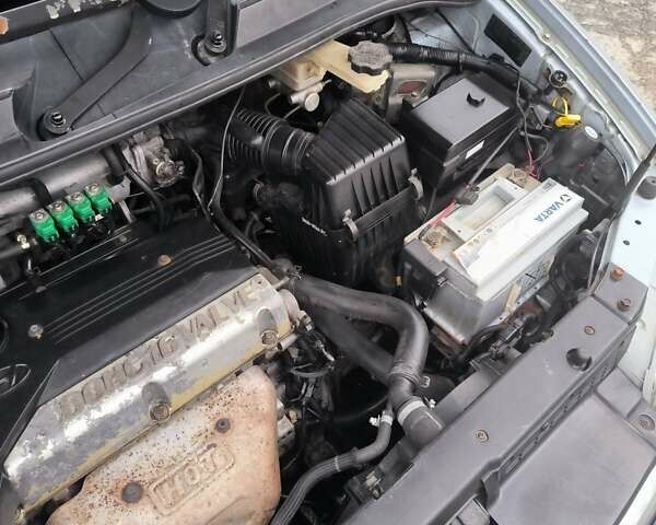 Синий Хендай Траджет, объемом двигателя 2 л и пробегом 300 тыс. км за 3900 $, фото 13 на Automoto.ua