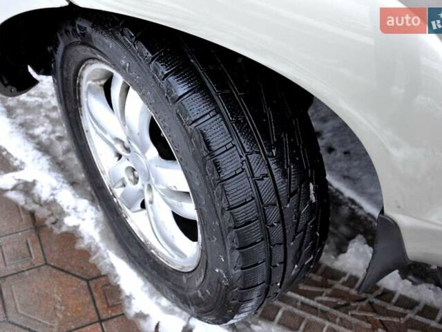 Бежевый Хендай Туксон, объемом двигателя 1.98 л и пробегом 257 тыс. км за 6500 $, фото 29 на Automoto.ua