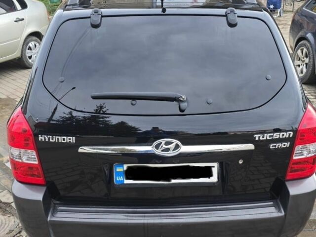 Черный Хендай Туксон, объемом двигателя 2 л и пробегом 217 тыс. км за 7195 $, фото 2 на Automoto.ua