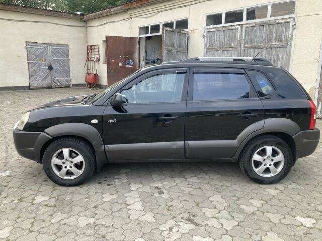 Чорний Хендай Туксон, об'ємом двигуна 2 л та пробігом 248 тис. км за 6500 $, фото 1 на Automoto.ua