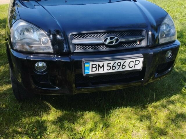 Черный Хендай Туксон, объемом двигателя 2 л и пробегом 230 тыс. км за 8200 $, фото 7 на Automoto.ua