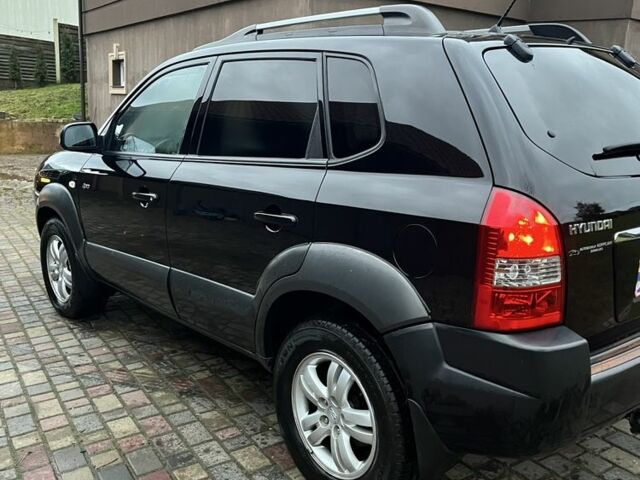 Чорний Хендай Туксон, об'ємом двигуна 2 л та пробігом 175 тис. км за 8200 $, фото 3 на Automoto.ua