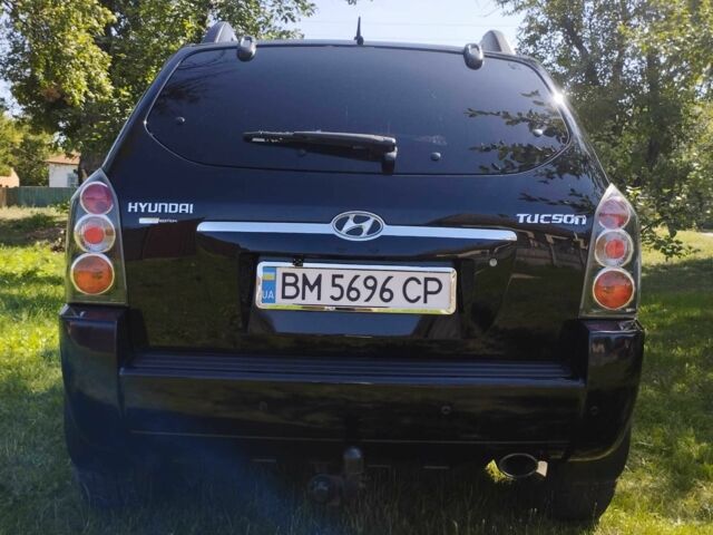 Черный Хендай Туксон, объемом двигателя 2 л и пробегом 230 тыс. км за 8200 $, фото 5 на Automoto.ua