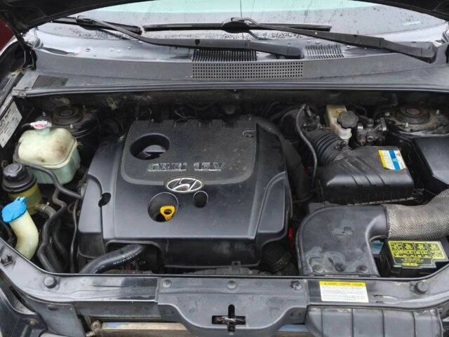 Черный Хендай Туксон, объемом двигателя 2 л и пробегом 180 тыс. км за 8300 $, фото 6 на Automoto.ua