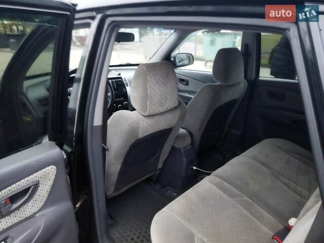 Черный Хендай Туксон, объемом двигателя 1.99 л и пробегом 204 тыс. км за 6100 $, фото 40 на Automoto.ua