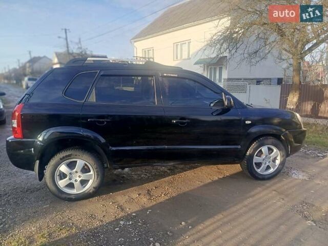 Черный Хендай Туксон, объемом двигателя 1.99 л и пробегом 302 тыс. км за 6300 $, фото 7 на Automoto.ua