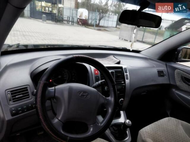 Черный Хендай Туксон, объемом двигателя 1.99 л и пробегом 204 тыс. км за 6100 $, фото 42 на Automoto.ua