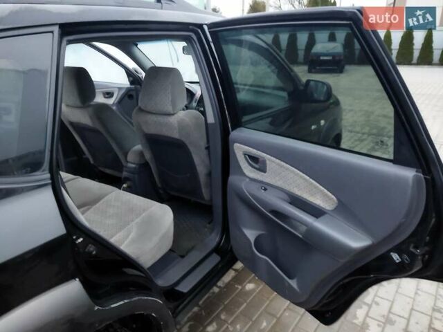 Черный Хендай Туксон, объемом двигателя 1.99 л и пробегом 204 тыс. км за 6100 $, фото 39 на Automoto.ua