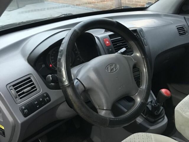 Чорний Хендай Туксон, об'ємом двигуна 2 л та пробігом 270 тис. км за 5850 $, фото 1 на Automoto.ua