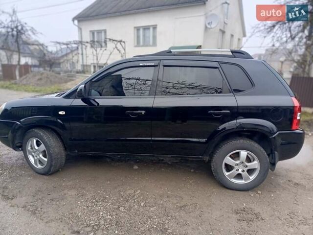 Черный Хендай Туксон, объемом двигателя 1.99 л и пробегом 302 тыс. км за 6300 $, фото 19 на Automoto.ua