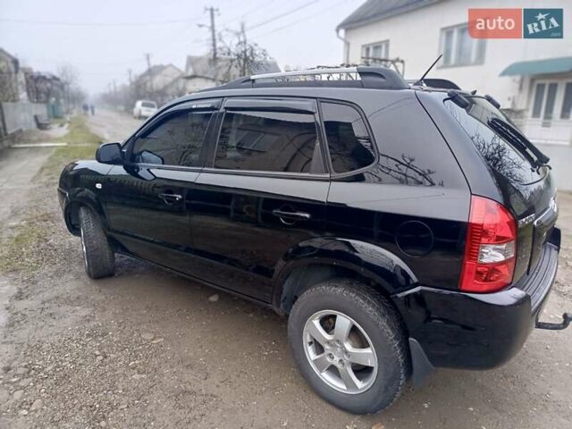 Черный Хендай Туксон, объемом двигателя 1.99 л и пробегом 302 тыс. км за 6300 $, фото 16 на Automoto.ua