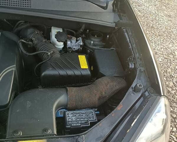 Черный Хендай Туксон, объемом двигателя 2 л и пробегом 236 тыс. км за 6000 $, фото 22 на Automoto.ua