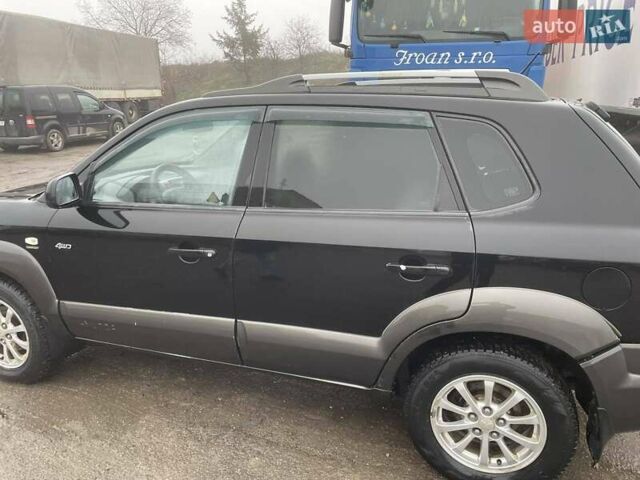 Черный Хендай Туксон, объемом двигателя 1.99 л и пробегом 204 тыс. км за 6100 $, фото 23 на Automoto.ua