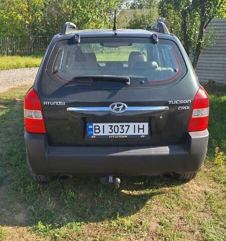 Черный Хендай Туксон, объемом двигателя 2 л и пробегом 240 тыс. км за 7300 $, фото 9 на Automoto.ua