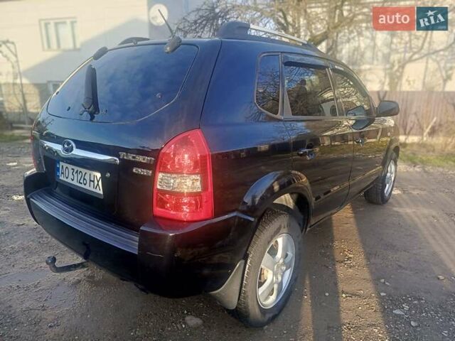 Черный Хендай Туксон, объемом двигателя 1.99 л и пробегом 302 тыс. км за 6300 $, фото 5 на Automoto.ua