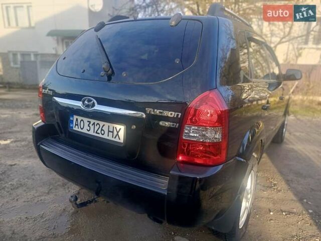 Черный Хендай Туксон, объемом двигателя 1.99 л и пробегом 302 тыс. км за 6300 $, фото 8 на Automoto.ua