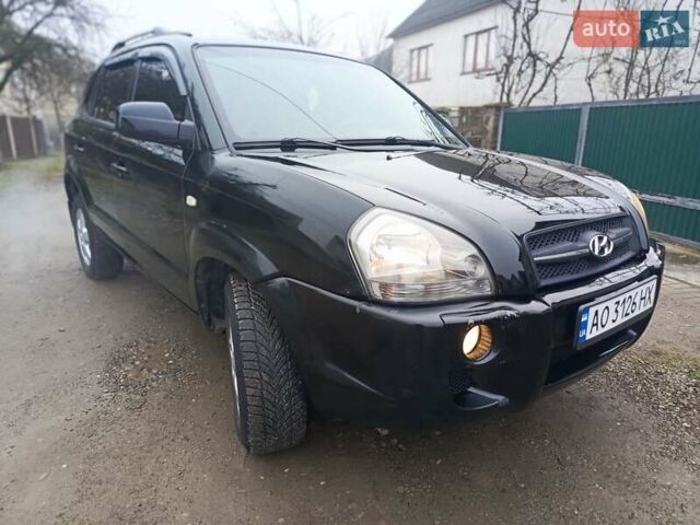 Черный Хендай Туксон, объемом двигателя 1.99 л и пробегом 302 тыс. км за 6300 $, фото 13 на Automoto.ua