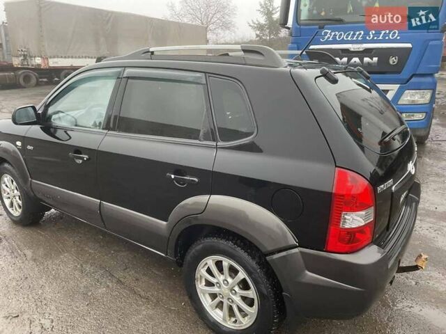 Черный Хендай Туксон, объемом двигателя 1.99 л и пробегом 204 тыс. км за 6100 $, фото 17 на Automoto.ua