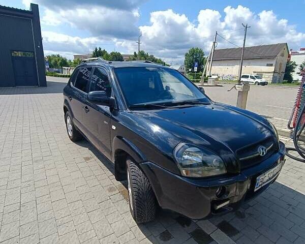 Черный Хендай Туксон, объемом двигателя 2 л и пробегом 235 тыс. км за 5500 $, фото 11 на Automoto.ua