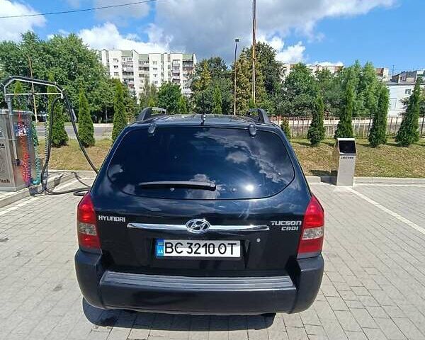 Черный Хендай Туксон, объемом двигателя 2 л и пробегом 235 тыс. км за 5500 $, фото 7 на Automoto.ua