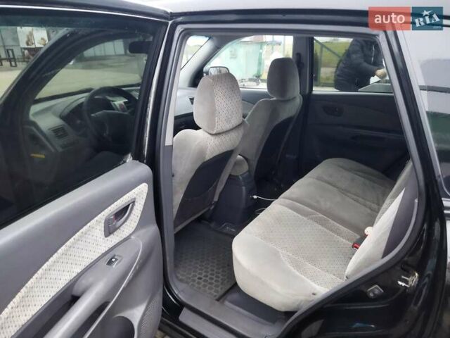 Черный Хендай Туксон, объемом двигателя 1.99 л и пробегом 204 тыс. км за 6100 $, фото 43 на Automoto.ua