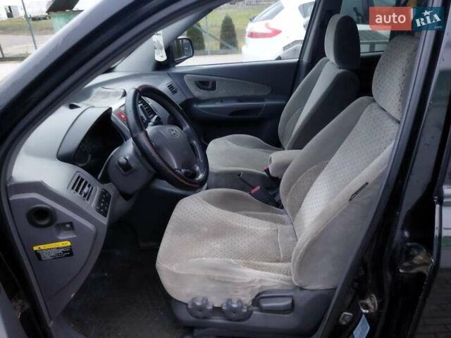 Черный Хендай Туксон, объемом двигателя 1.99 л и пробегом 204 тыс. км за 6100 $, фото 41 на Automoto.ua